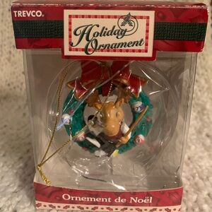 Moose pool player sitting in a Christmas wreath ornament.